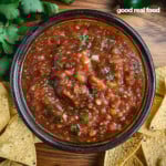a bowl of homemade salsa served with tortilla chips.