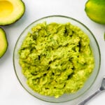 A glass bowl of mashed avocado, next to limes and fresh avocado and a fork for mashing. Healthy Food, Real Food, Real Food Recipes, Healthy Food Recipes, Wholesome food, Wholesome food recipes, Whole Food, Whole Food Recipes, Realgood food, Realfooddaily Eat real, Good Real Food, Goodrealfood, guacamole, healthy dip, fresh dip, easy dip, fresh veggie dip, vegetable dip, avocado dip, appetizer, side dish