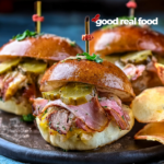 Cuban Sliders on a plate with chips.