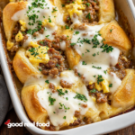 A baking dish filled with savory breakfast rolls.