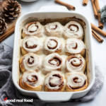 A baking pan filled with gingerbread cinnamon rolls.