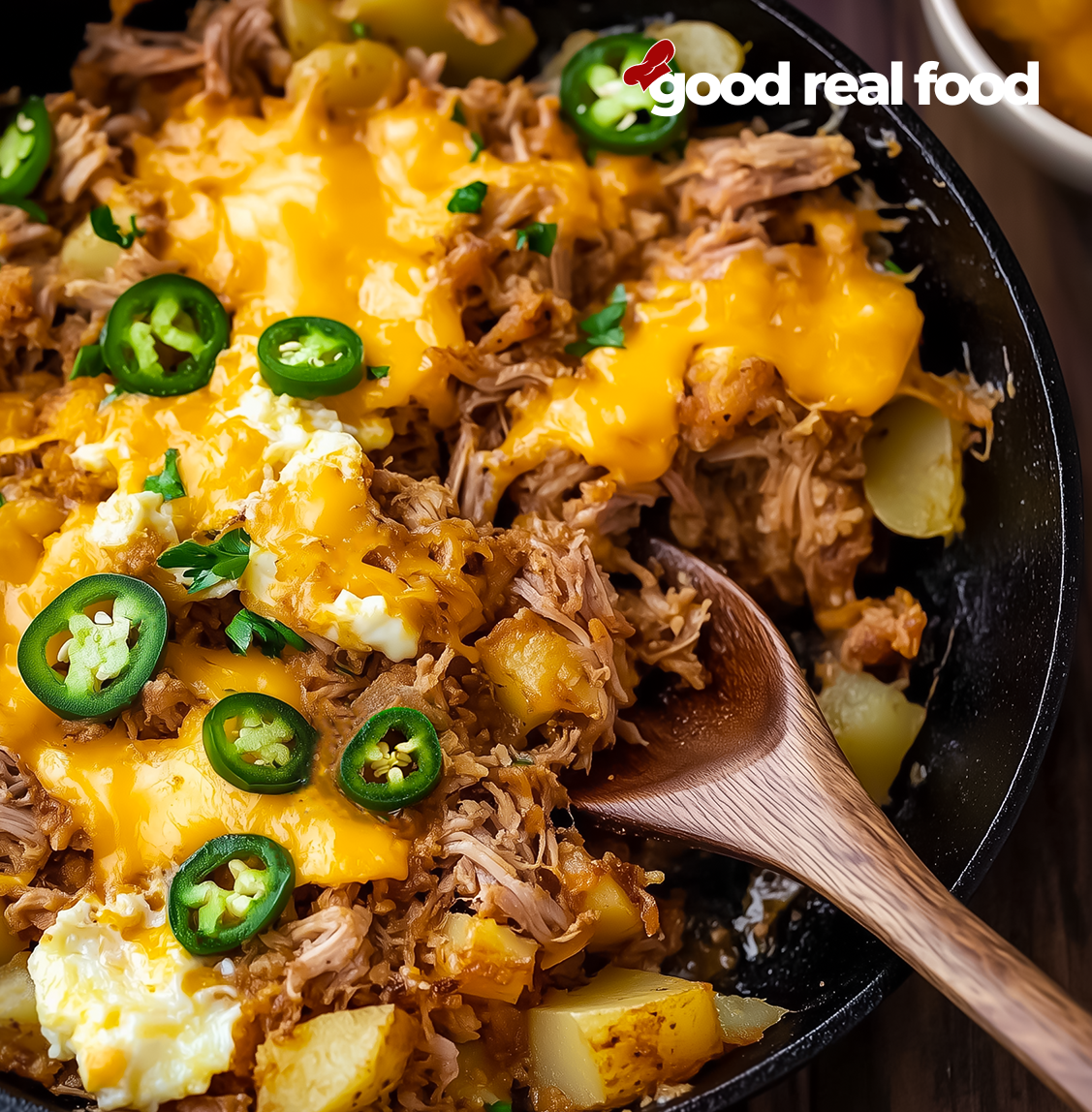 Pulled pork hash breakfast in a skillet.