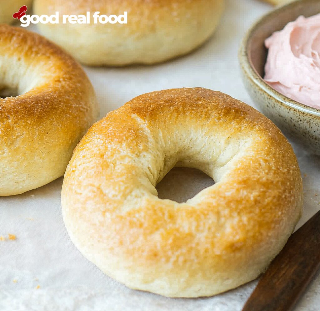 plain bagels served with a side of cream cheese.