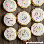 Decorated sugar cookies on a wood surface.