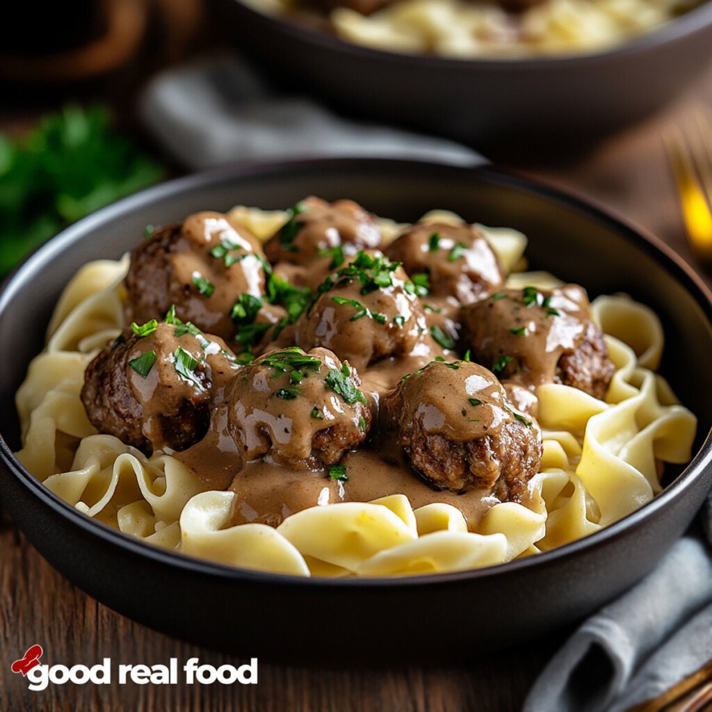 A bowl of Swedish meatballs and gravy over egg noodles.