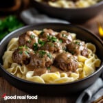 A bowl of Swedish meatballs and gravy over egg noodles.