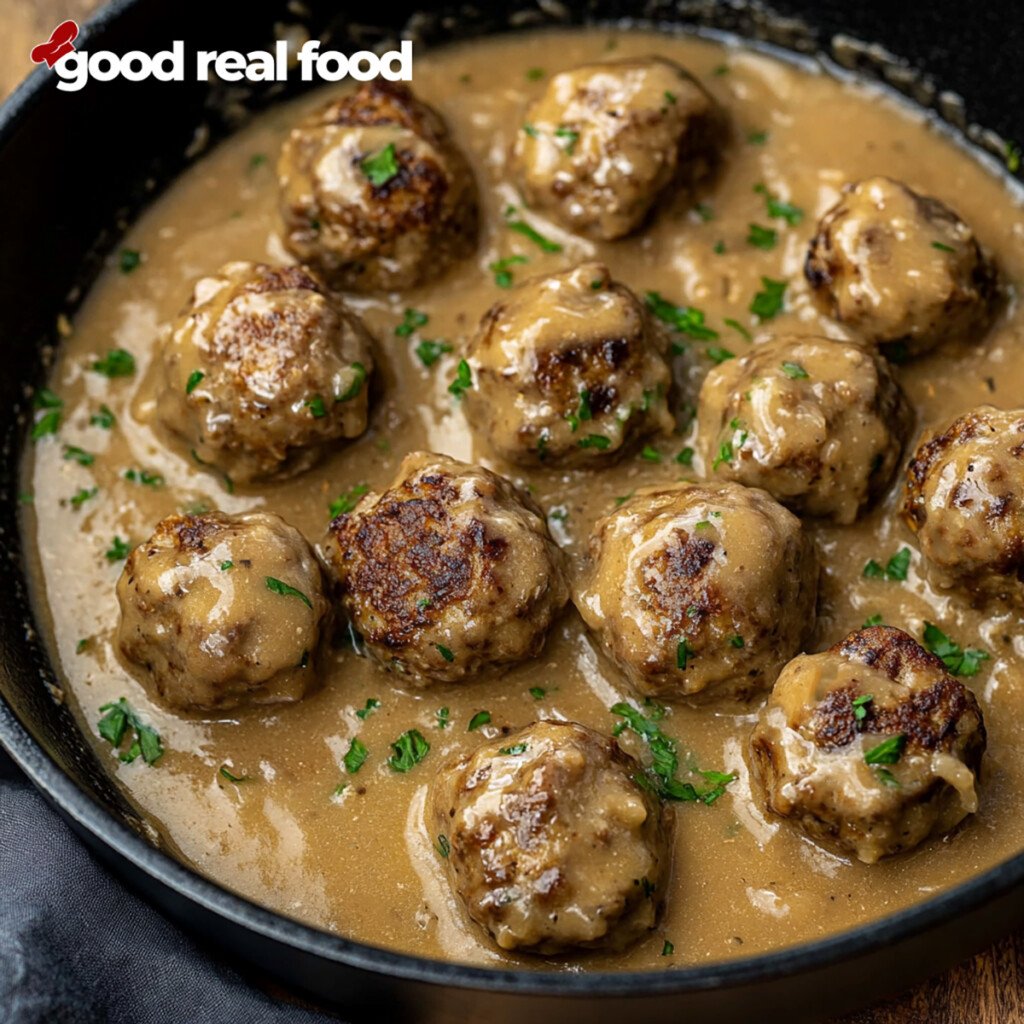 Swedish meatballs and gravy in a skillet.