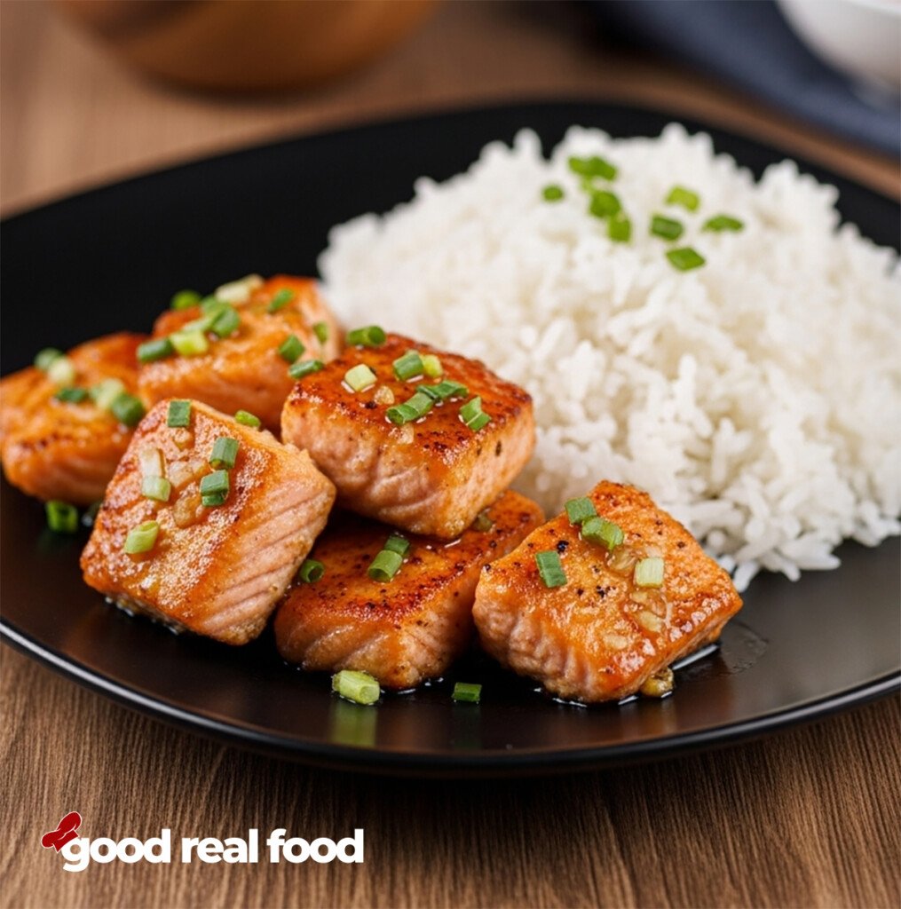 A plate of honey garlic salmon and rice.