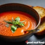 Roasted Red Pepper Soup in a brown bowl.