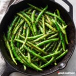 A skillet of spicy garlic green beans.