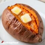A baked sweet potato with butter.