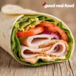 Turkey wrap on a wooden surface.
