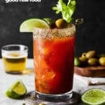 A bloody mary with lime, olives, and a chaser.