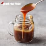 Homemade caramel sauce in a mason jar.
