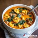 One pot sausage tortellini soup in a bowl.