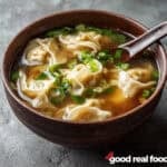 A brown bowl of wonton soup