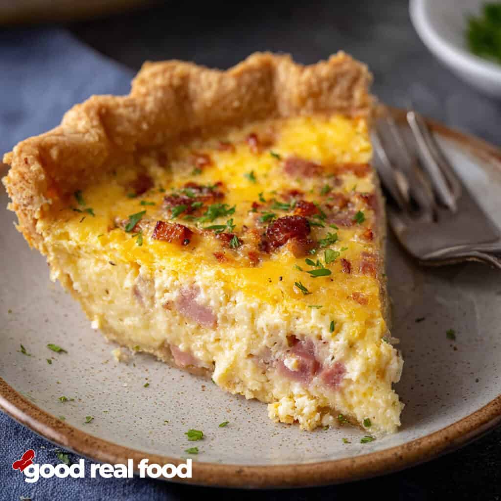 Quiche Lorraine on a plate with a fork.