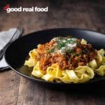 Bolognese sauce served over wide noodles.