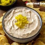 A bowl of Mississippi Pot Roast Dip with potato chips.