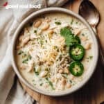 A ceramic bowl of white chicken chili.