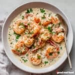 A bowl of creamy garlic shrimp.