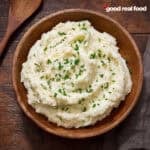 cauliflower mashed potatoes in a wooden bowl.