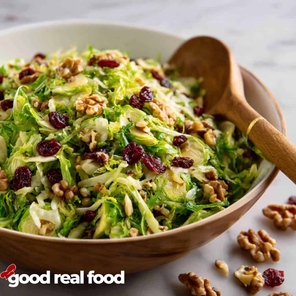 Shaved Brussels Sprout salad in a large serving bowl.