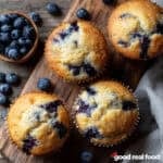 Blueberry Muffins on a wooden board.