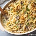 Overhead view of a casserole dish of Chicken Tetrazzini with a fork in the dish.
