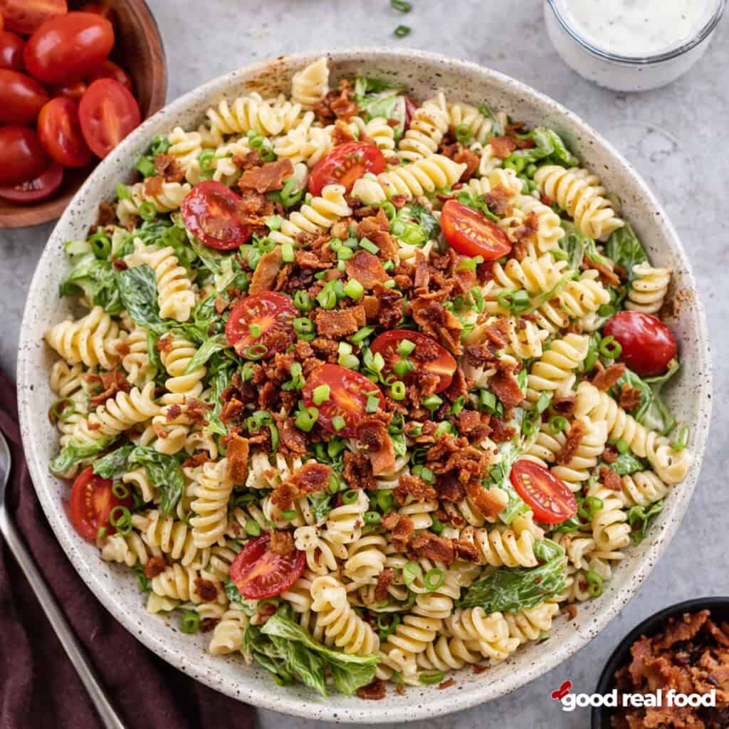 A white bowl filled with BLT Pasta Salad.