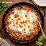 Cheesy Taco Chicken and Rice with a serving spoon.