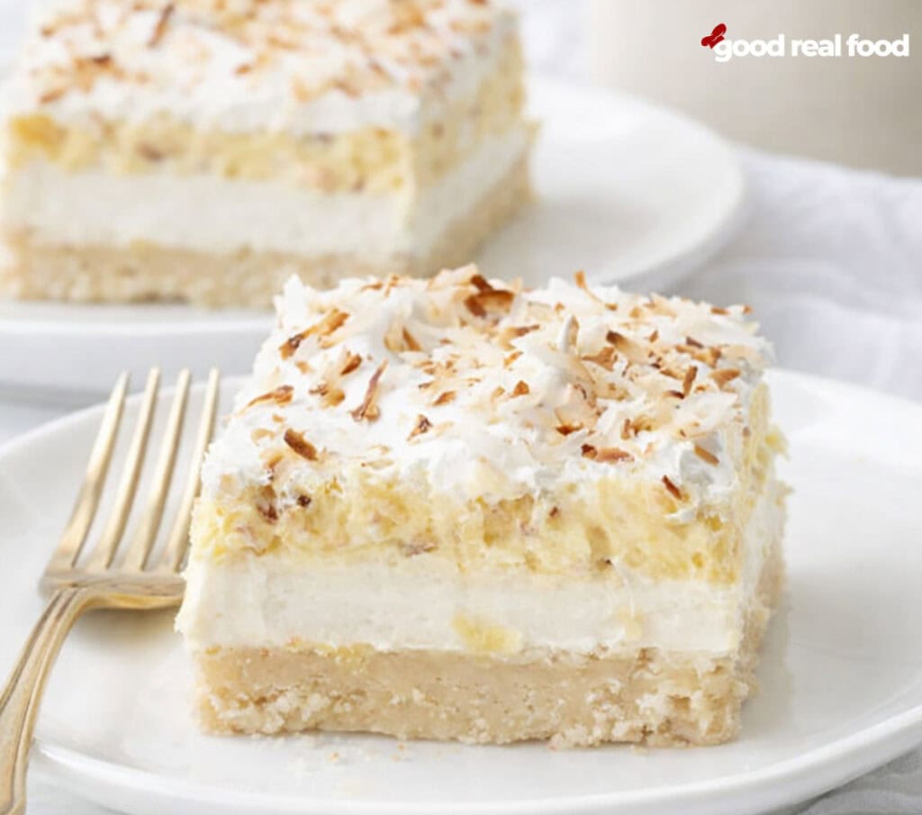 Coconut Cream Pie Bars on a white plate.