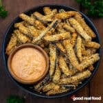 a black bowl of eggplant fries.