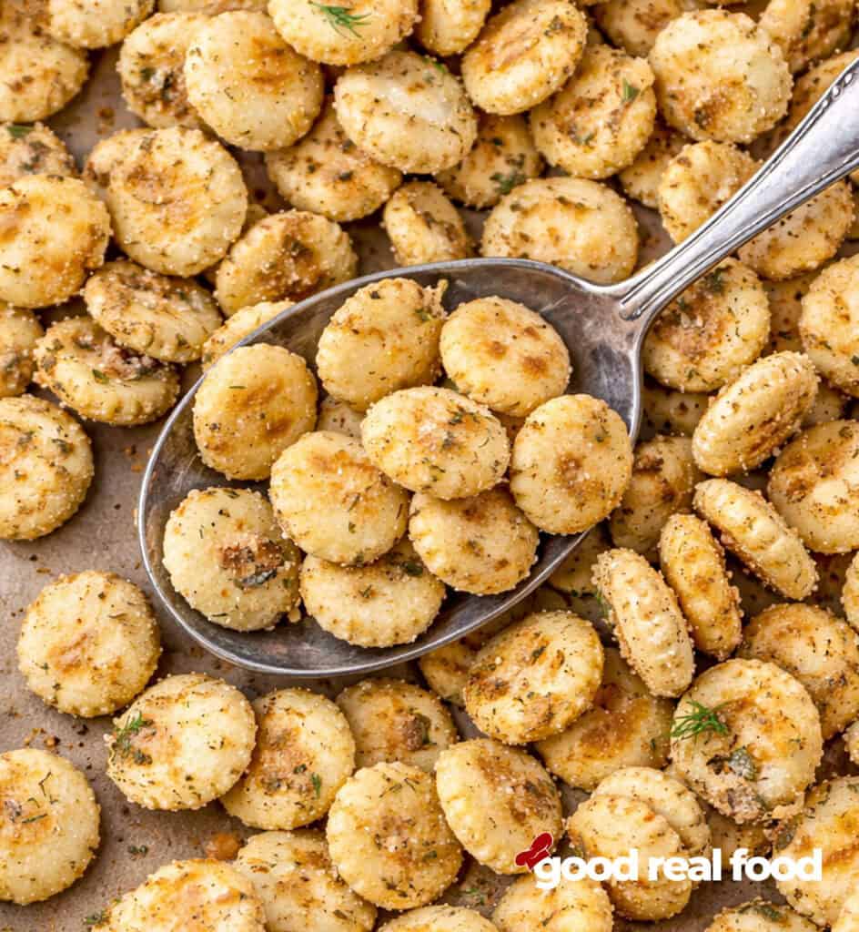 Ranch Oyster Crackers with a spoon.