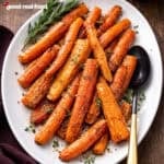 Air Fryer Rosemary Carrots on a white platter.