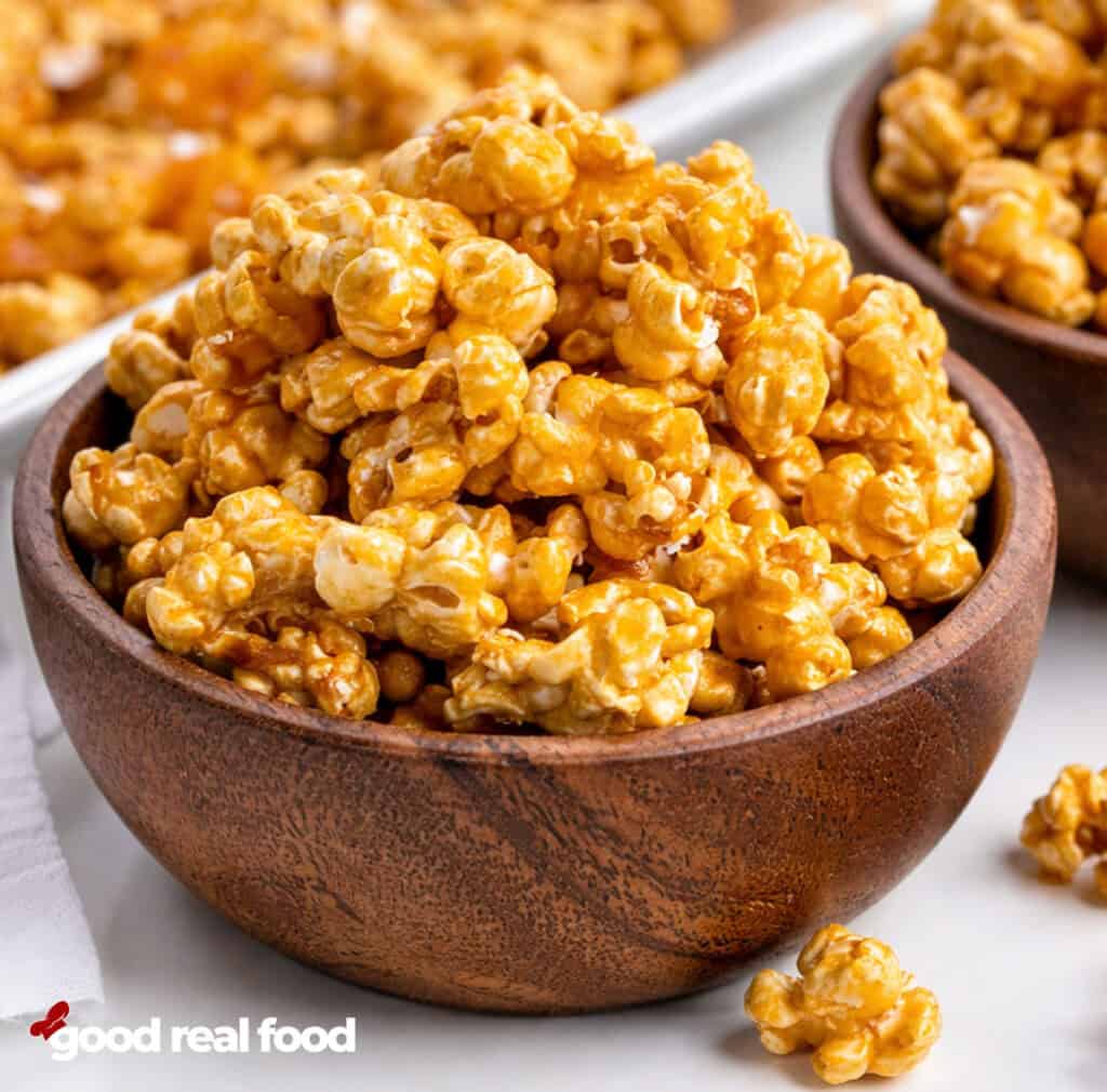 A wooden bowl of caramel corn.