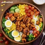 Chipotle Cobb chicken salad in a wooden bowl.