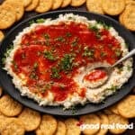 a black platter of crab dip