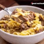 Slow cooker beef and noodles in a bowl.