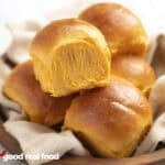 Sweet potato dinner rolls in a basket.
