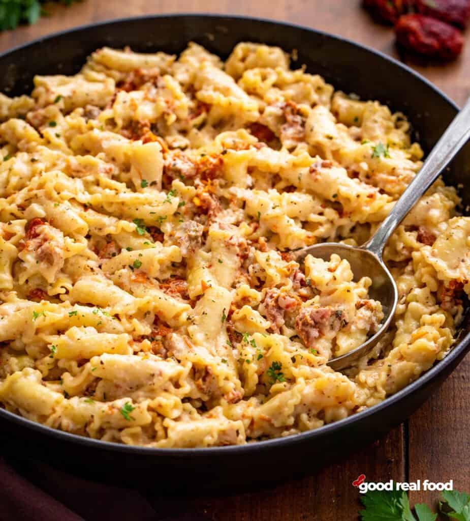 Creamy tuscan pasta in a skillet.
