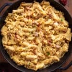 Creamy tuscan pasta in a skillet.