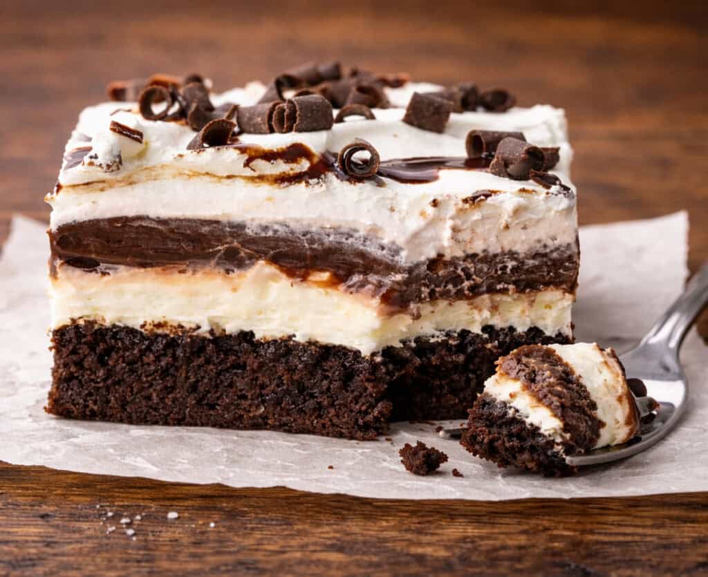 Chocolate Brownie Lush Dessert with a bite out.