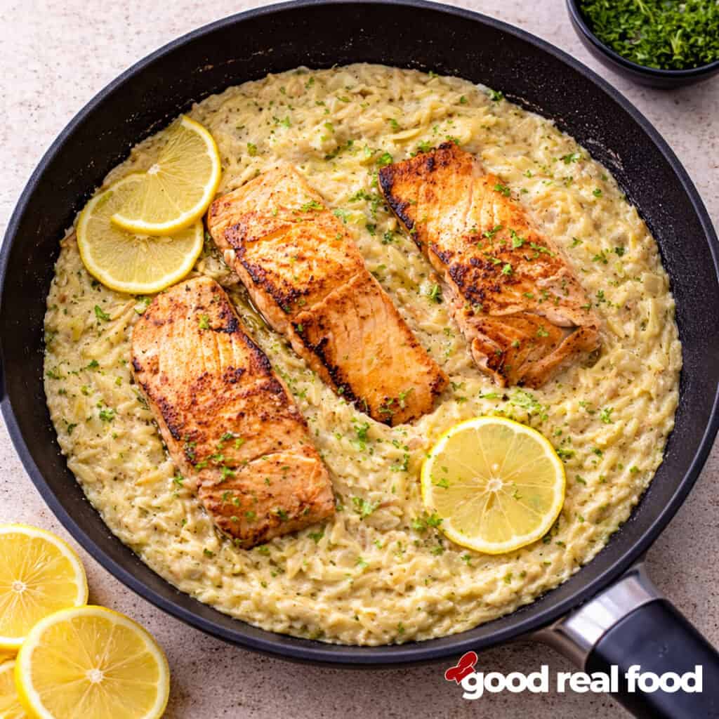 salmon and creamy lemon orzo in a pan.