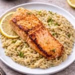 salmon and creamy lemon orzo on a plate.
