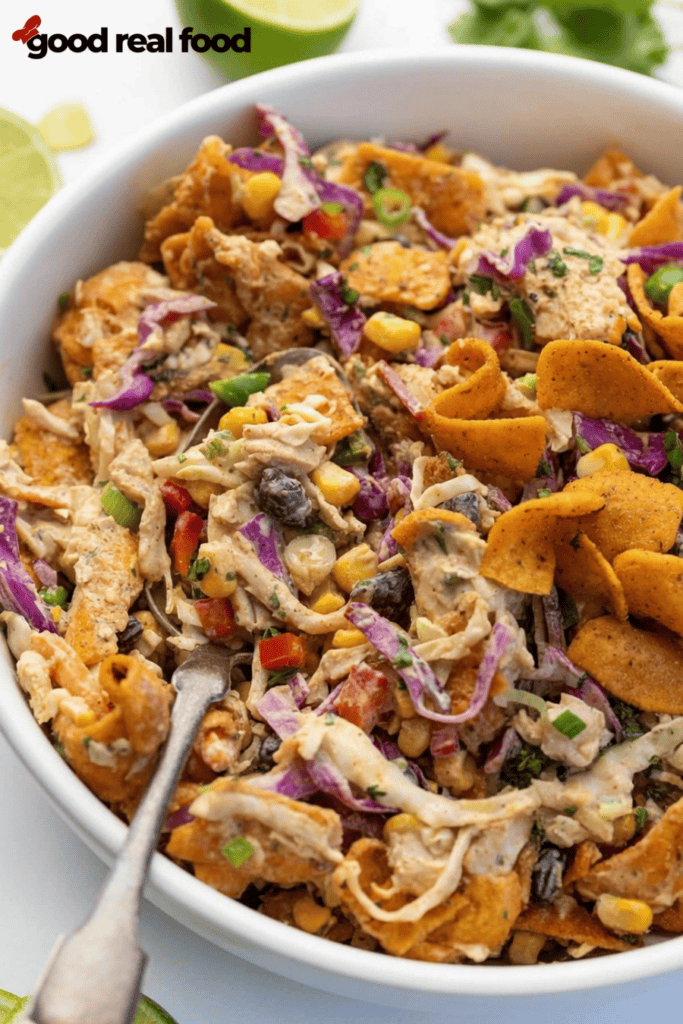 Extra close up version of Chicken Cowboy Cabbage in a white bowl, with spoon in bowl Extra close up version of Chicken Cowboy Cabbage in a white bowl, with spoon in bowl.