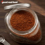 a jar of Taco Seasoning on a wood counter