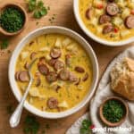 two bowls of spicy cajun potato soup next to bread, two bowls of garnish, and a cloth napkin